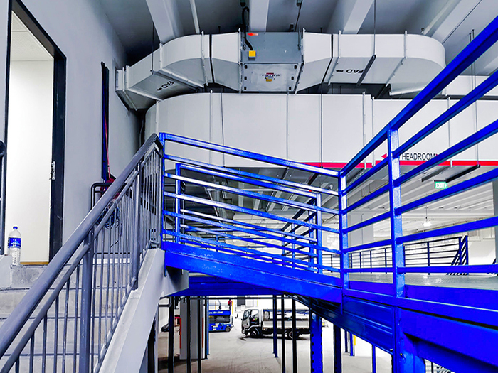 Linkway or link bridge from mezzanine to existing staircase, installing mezzanine on Tuas Singapore project - Racknsave Racking Solutions.